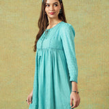 Side view of Model wearing blue moth and stripe block printed empire line dress – RA Studio