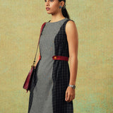 Side view of Sleeveless black and grey panel A-line dress with red belt detailing – RA Studio