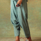 Close-up of moth block print detail on green Turkish pants – RA Studio