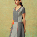 Patchwork dress in shades of grey with bold orange side pocket – RA Studio