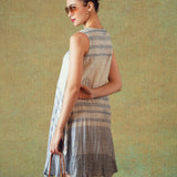 Model wearing blue crinkled empire-line shift dress with layered block-print stripes and pockets – RA Studio