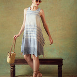 Model wearing blue crinkled empire-line shift dress with layered block-print stripes and pockets – RA Studio