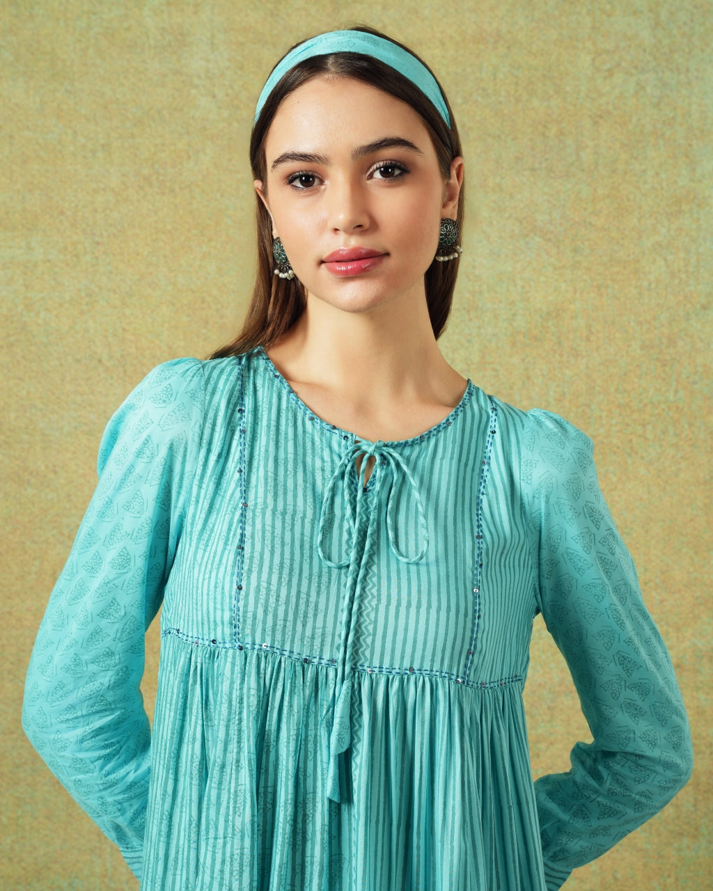 Close up of Model wearing blue moth and stripe block printed empire line dress – RA Studio