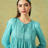 Close up of Model wearing blue moth and stripe block printed empire line dress – RA Studio