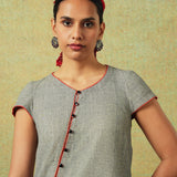Front Close up Short-sleeved grey A-line dress with subtle black and white accents – RA Studio