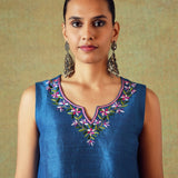 Close-up of blue Dupion silk hand embroidery on sleeveless top