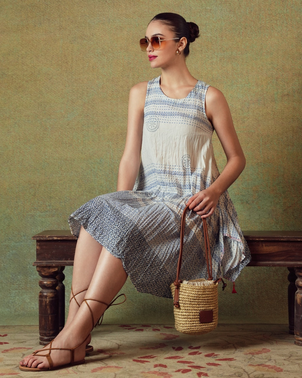Model wearing blue crinkled empire-line shift dress with layered block-print stripes and pockets – RA Studio
