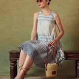 Model wearing blue crinkled empire-line shift dress with layered block-print stripes and pockets – RA Studio