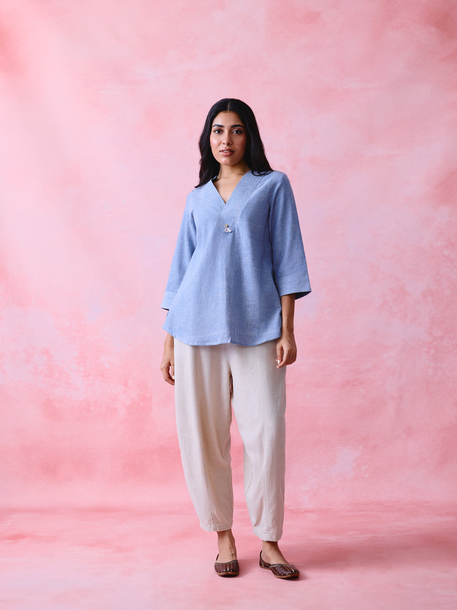 Woman wearing soft blue crinkled Khadi V-neck tunic