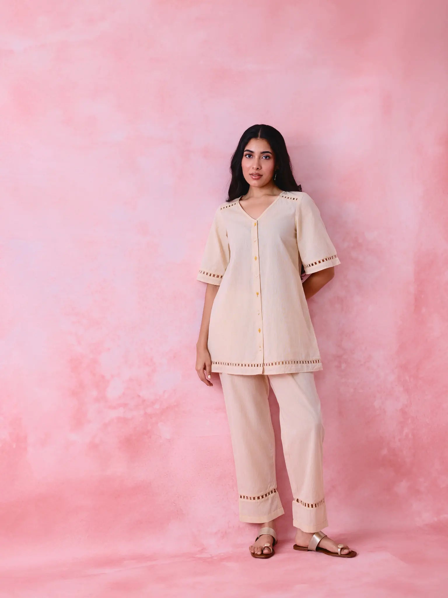 Beige cotton Mangalgiri co-ord with a front-open mid-length kurta and straight pants, both with slot detailing.