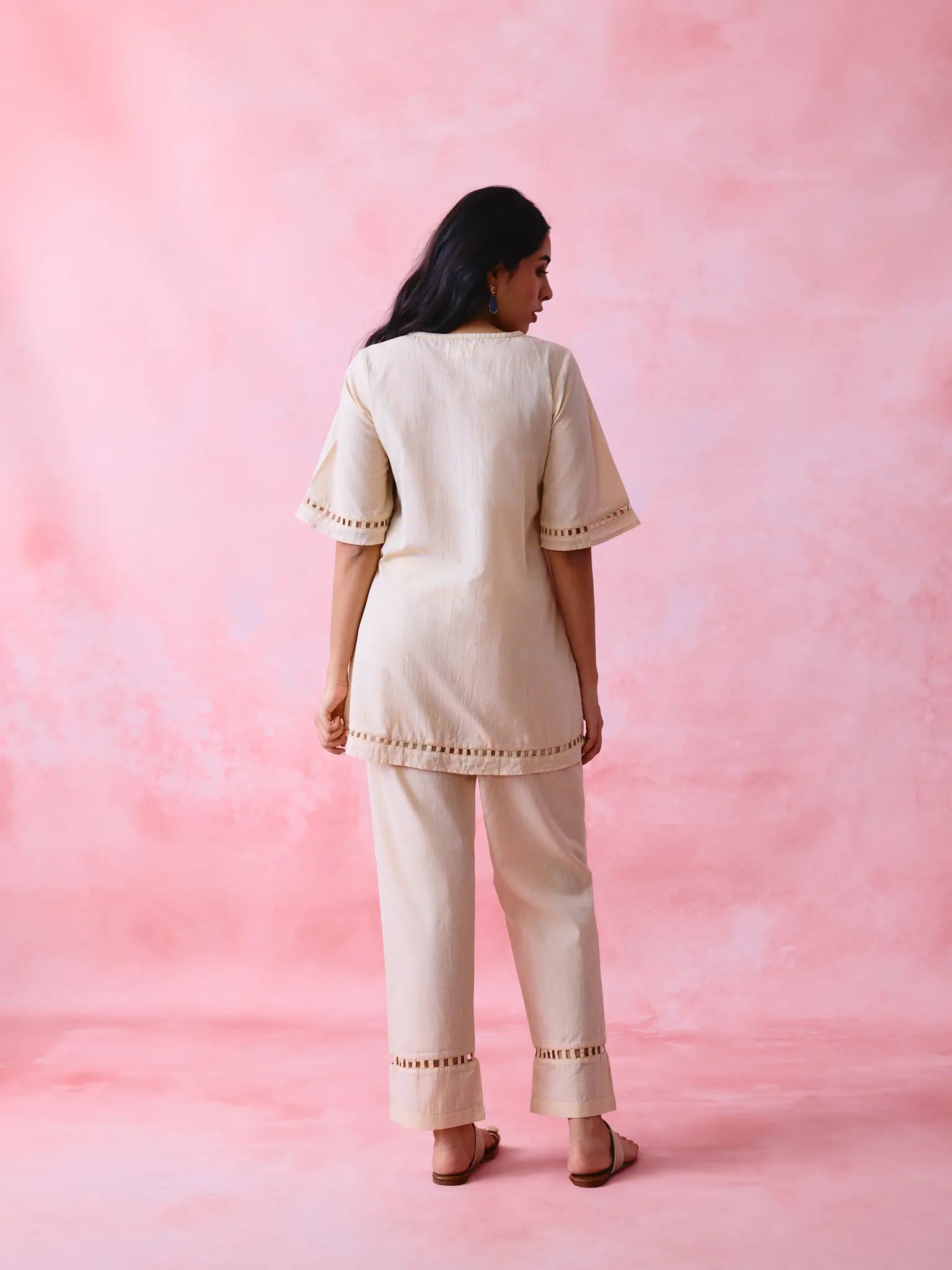 Beige cotton Mangalgiri co-ord with a front-open mid-length kurta and straight pants, both with slot detailing.