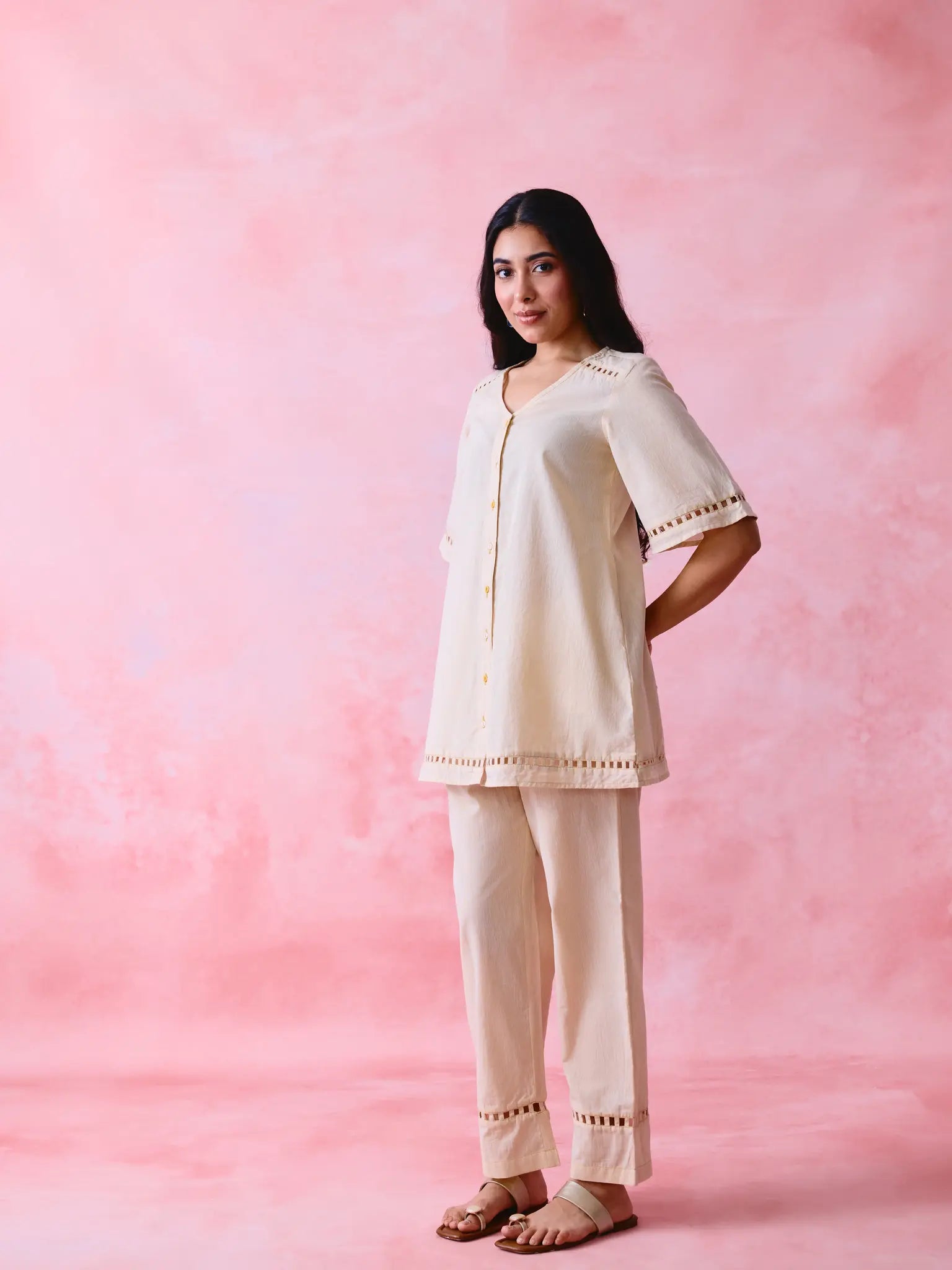 Beige cotton Mangalgiri co-ord with a front-open mid-length kurta and straight pants, both with slot detailing.