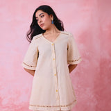 Beige cotton Mangalgiri co-ord with a front-open mid-length kurta and straight pants, both with slot detailing.