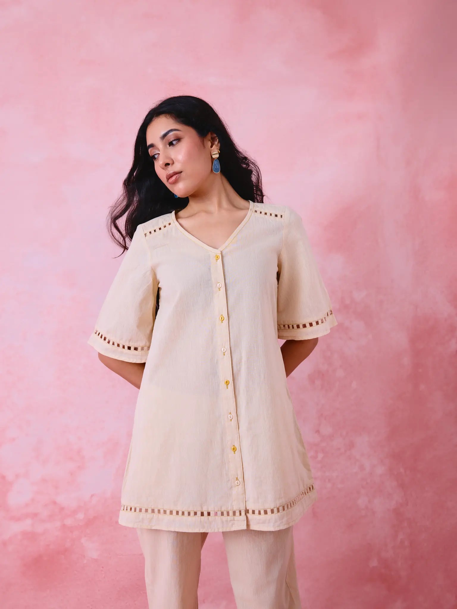 Beige cotton Mangalgiri co-ord with a front-open mid-length kurta and straight pants, both with slot detailing.