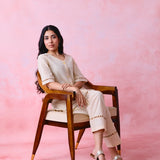 Beige cotton Mangalgiri co-ord with a front-open mid-length kurta and straight pants, both with slot detailing.