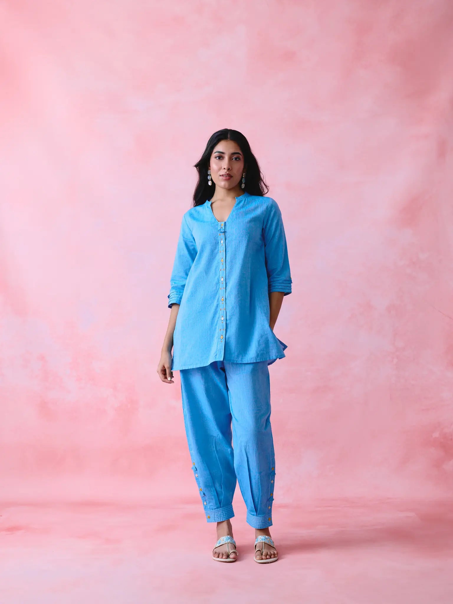 Blue cotton Mangalgiri kurta and pant co-ord with multicolour buttons, hand embroidery and cotton-bell details.