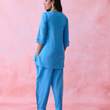 Blue cotton Mangalgiri kurta and pant co-ord with multicolour buttons, hand embroidery and cotton-bell details.