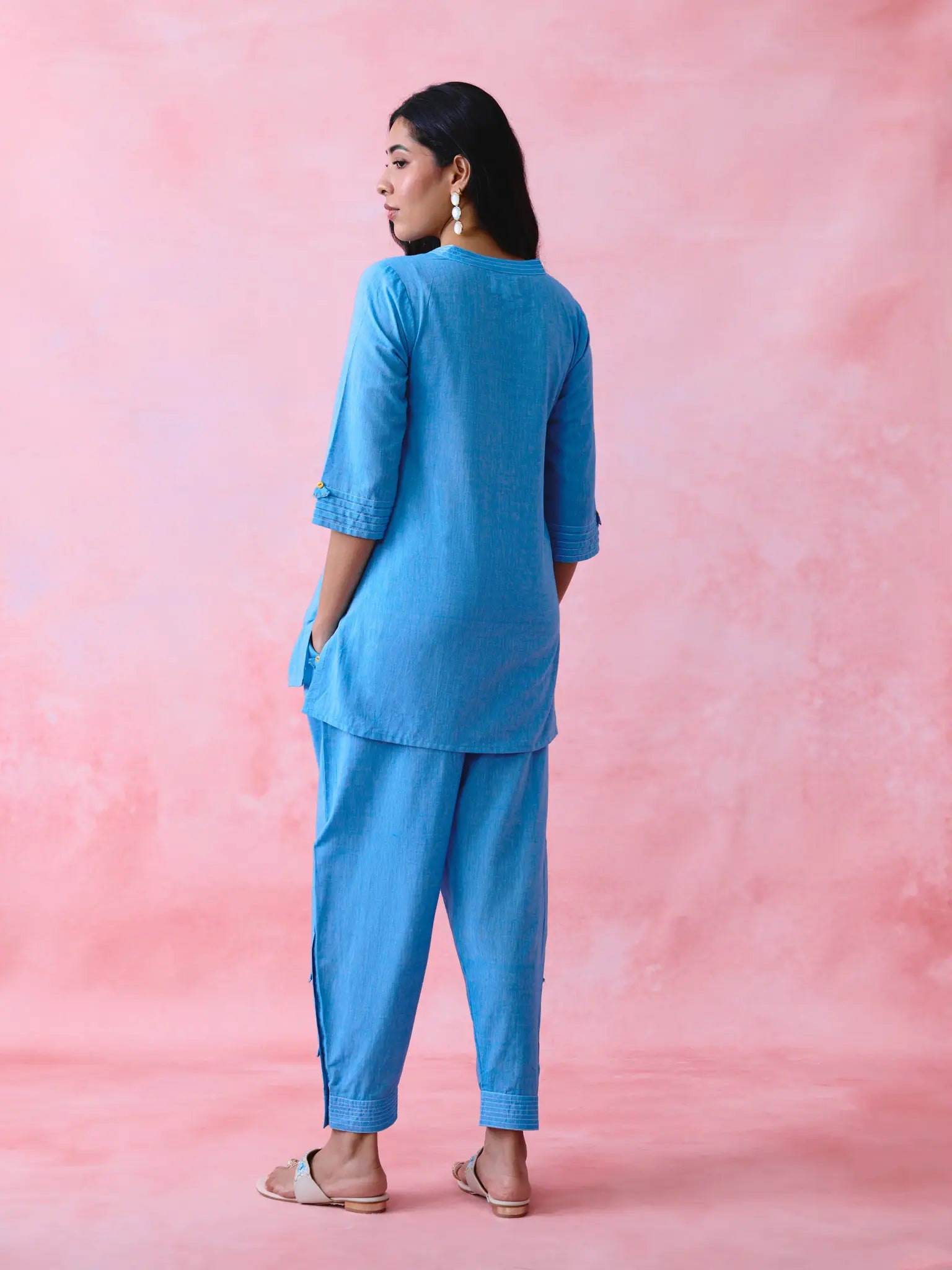 Blue cotton Mangalgiri kurta and pant co-ord with multicolour buttons, hand embroidery and cotton-bell details.