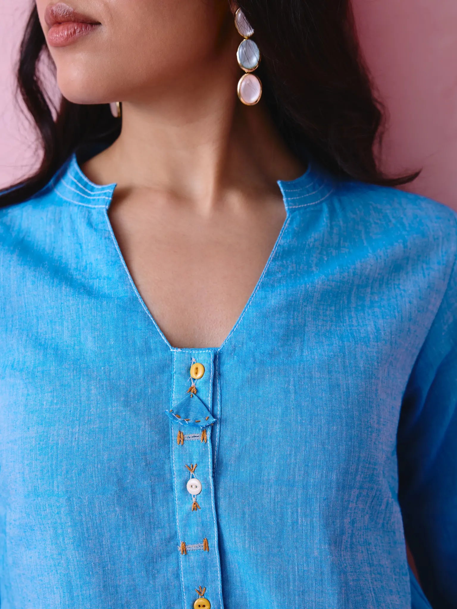 Blue cotton Mangalgiri kurta and pant co-ord with multicolour buttons, hand embroidery and cotton-bell details.
