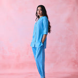 Blue cotton Mangalgiri kurta and pant co-ord with multicolour buttons, hand embroidery and cotton-bell details.