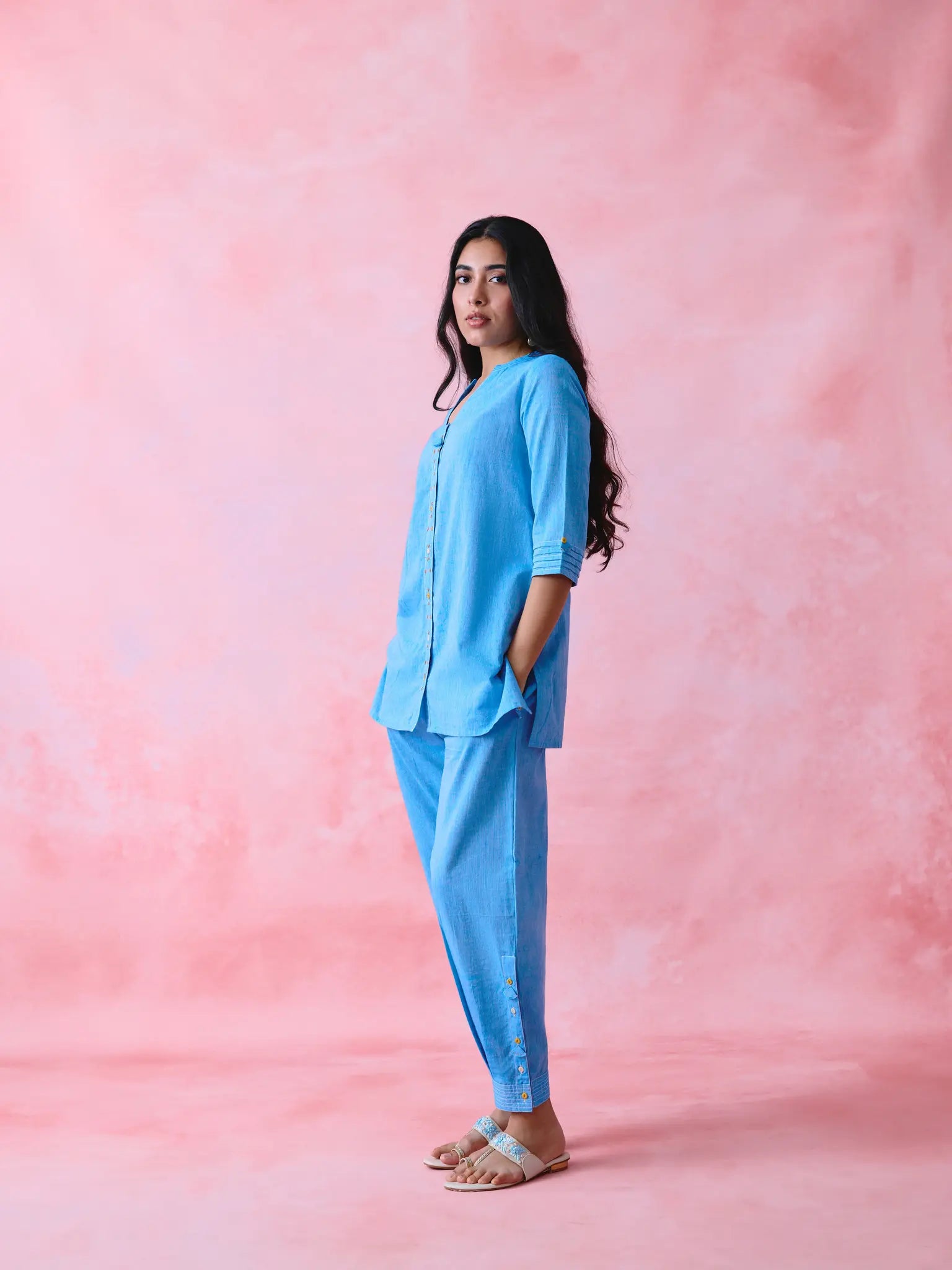 Blue cotton Mangalgiri kurta and pant co-ord with multicolour buttons, hand embroidery and cotton-bell details.