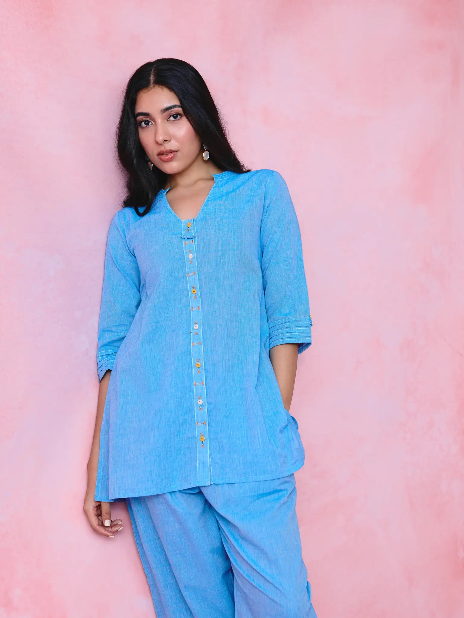 Blue cotton Mangalgiri kurta and pant co-ord with multicolour buttons, hand embroidery and cotton-bell details.