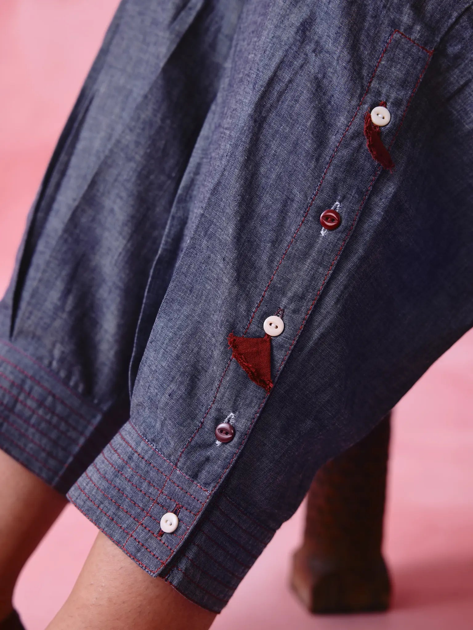 Grey cotton Mangalgiri kurta and pant co-ord with hand embroidery, multicolour buttons and cotton-bell details.