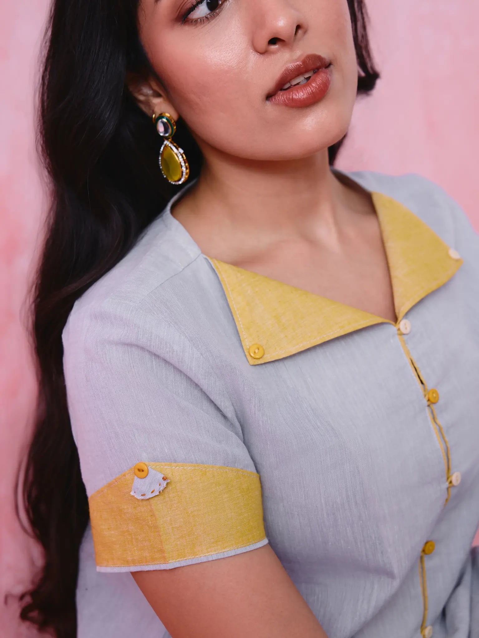 Grey cotton Mangalgiri kurta and straight-pant co-ord with a flap collar, loop buttons and mustard-yellow accents.