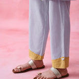 Grey cotton Mangalgiri kurta and straight-pant co-ord with a flap collar, loop buttons and mustard-yellow accents.