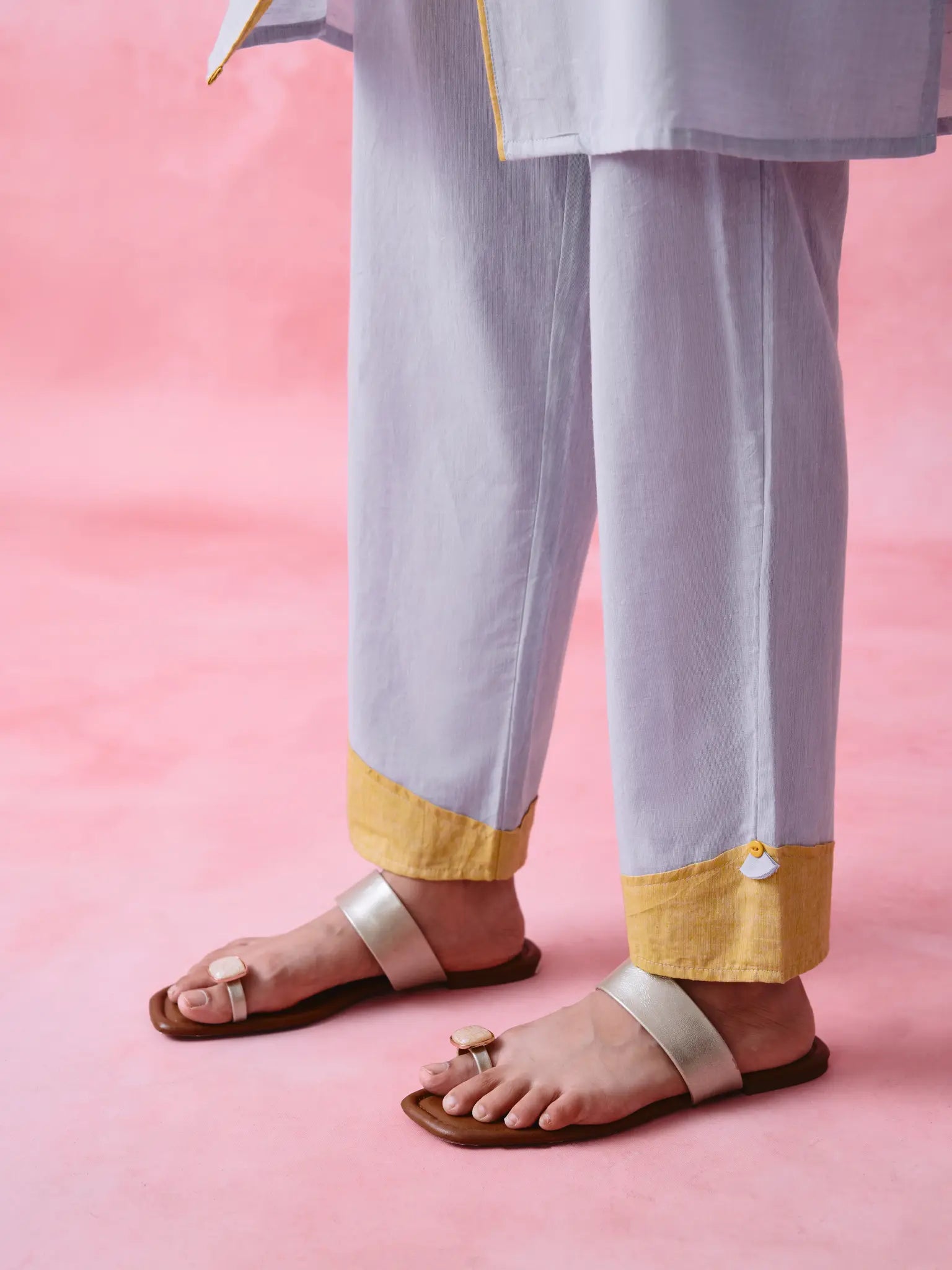 Grey cotton Mangalgiri kurta and straight-pant co-ord with a flap collar, loop buttons and mustard-yellow accents.