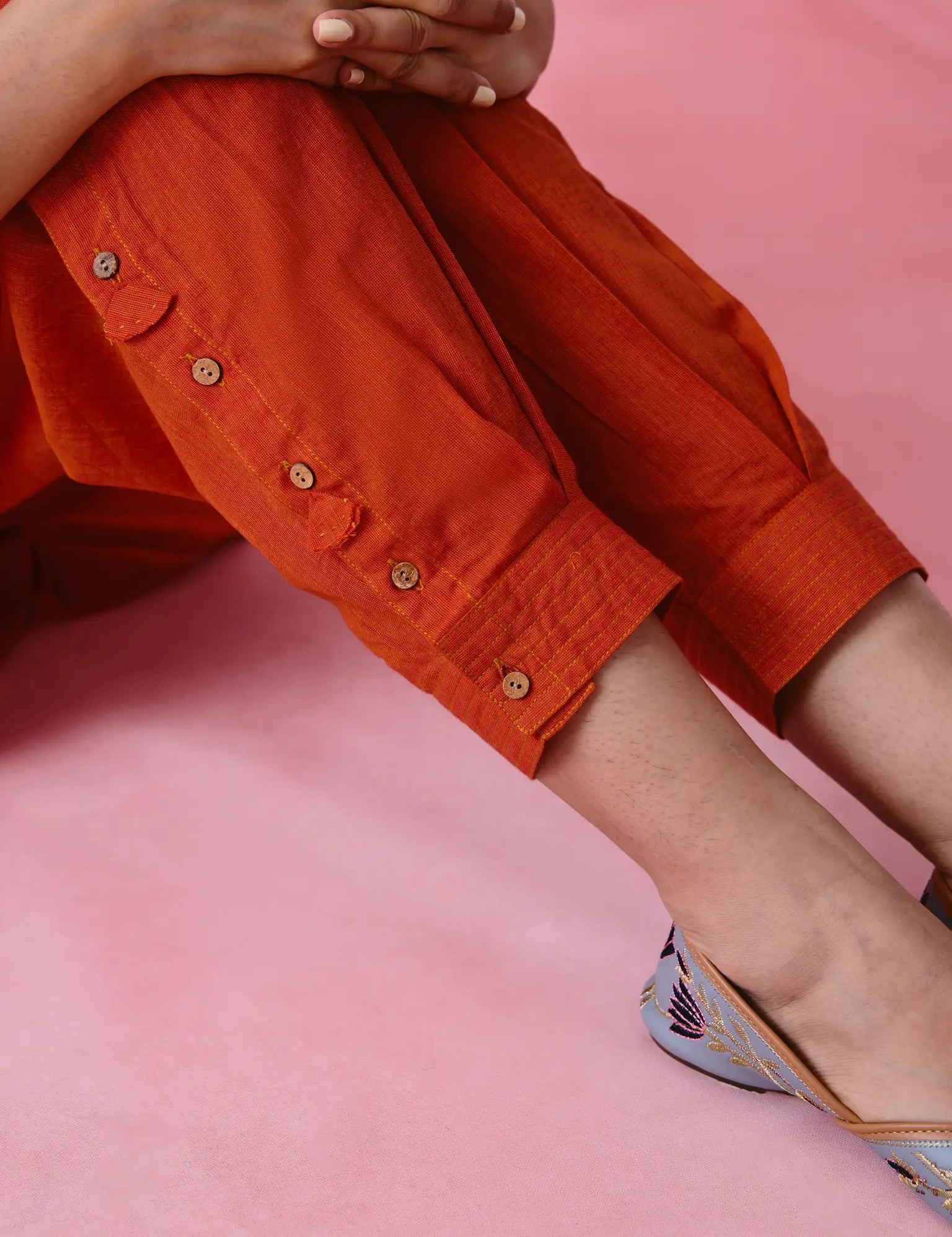 Woman in red bell detail pants