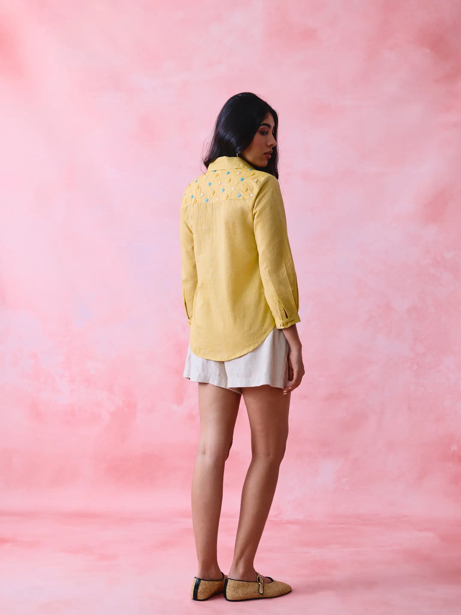 Yellow cotton Mangalgiri yoke shirt with multicolour button detailing.