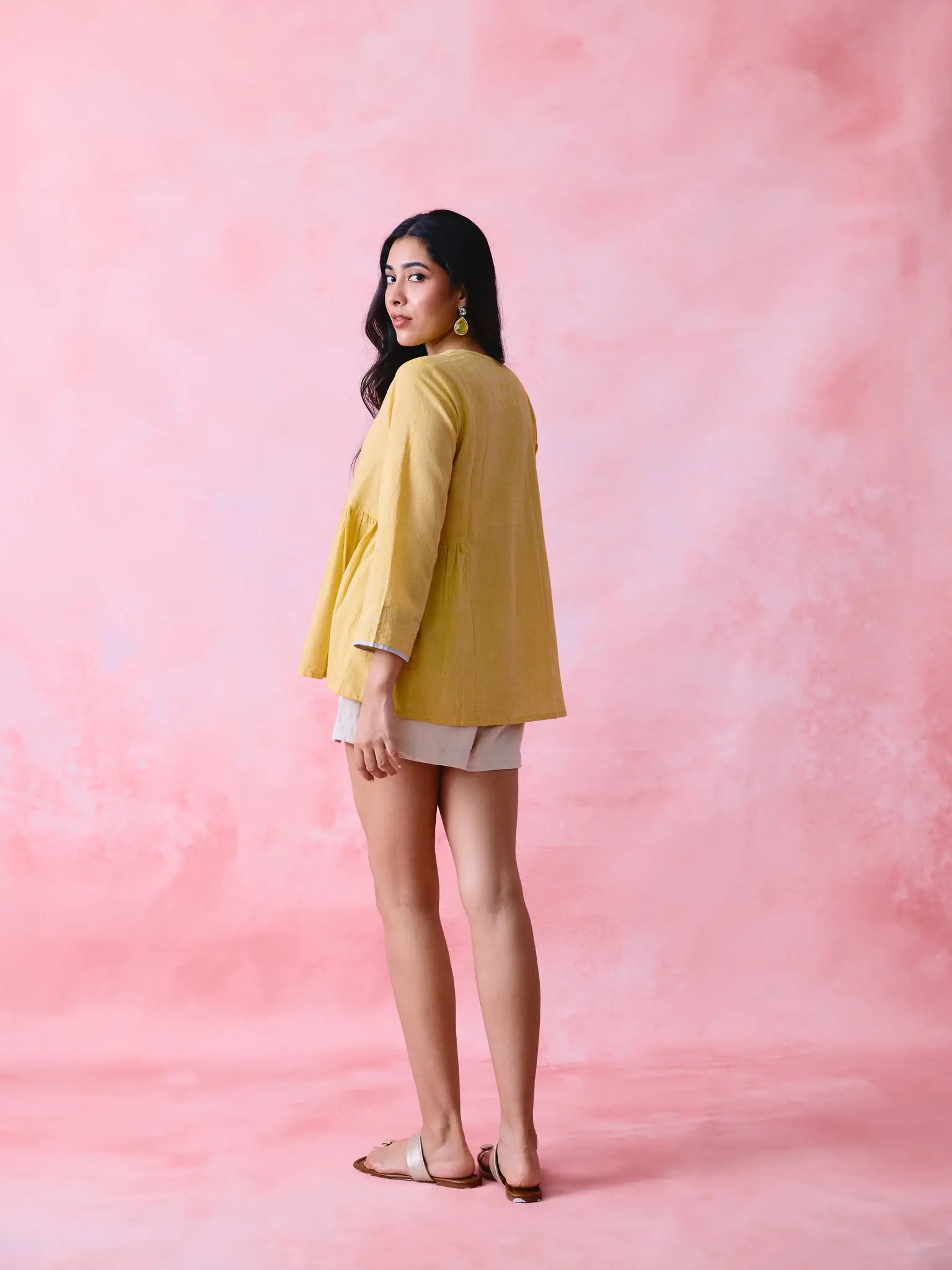 Yellow cotton Mangalgiri tunic with side gathers, front loop buttons and contrasting grey trim.
