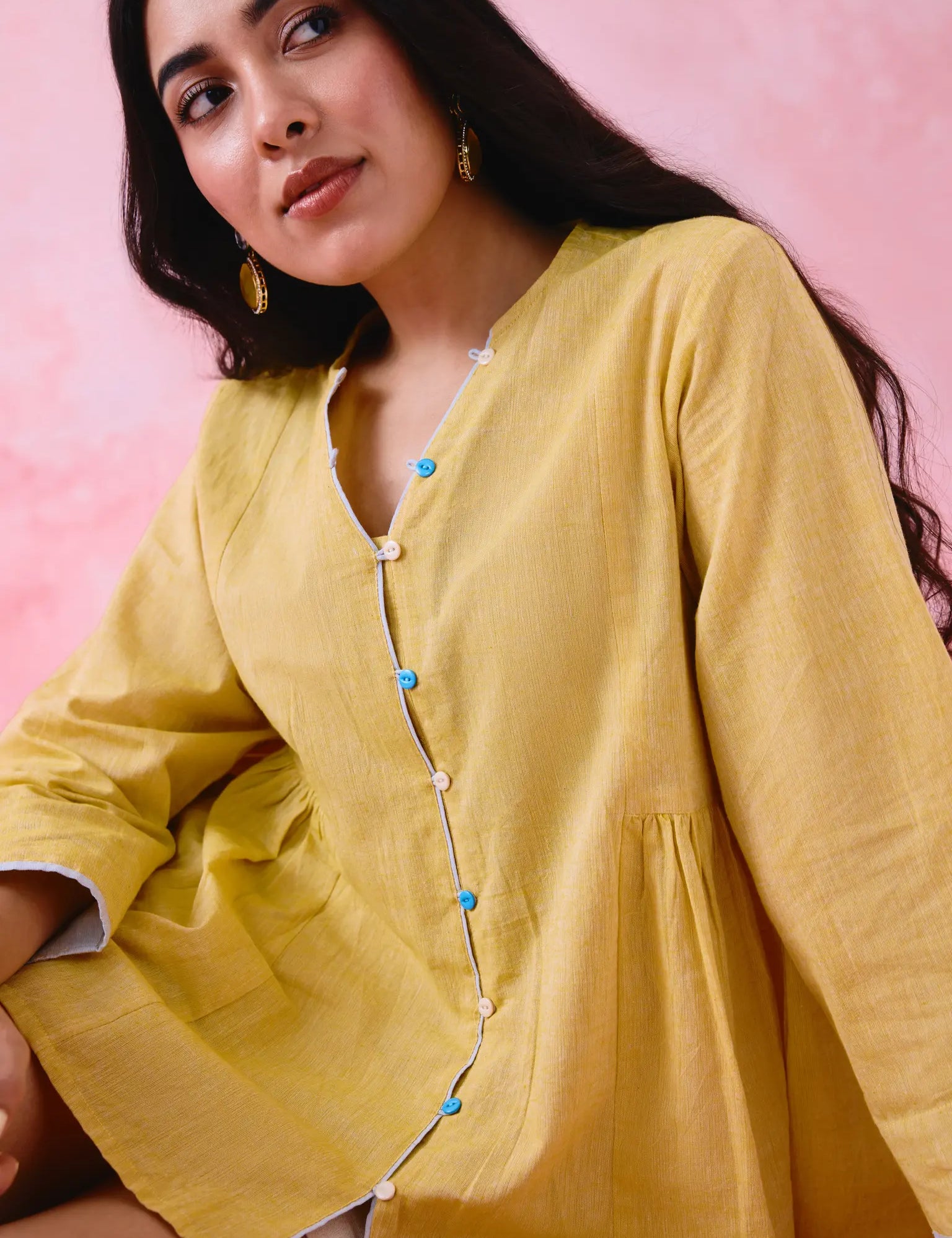 Woman wearing yellow front-open tunic