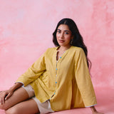 Yellow cotton Mangalgiri tunic with side gathers, front loop buttons and contrasting grey trim.