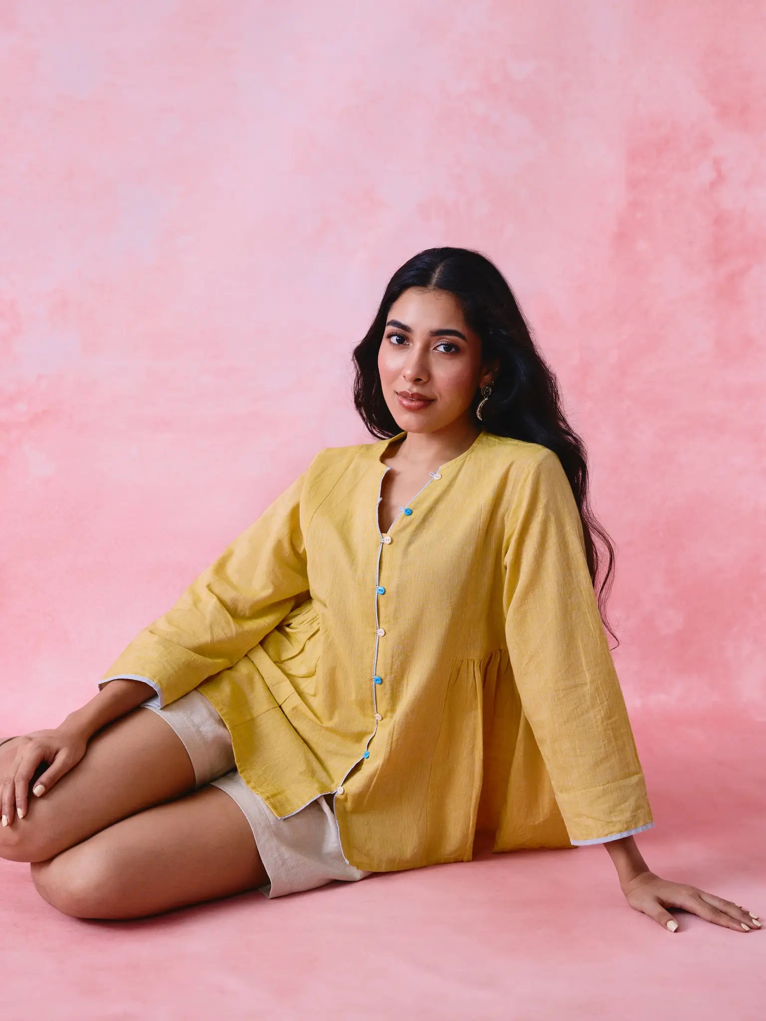 Yellow cotton Mangalgiri tunic with side gathers, front loop buttons and contrasting grey trim.