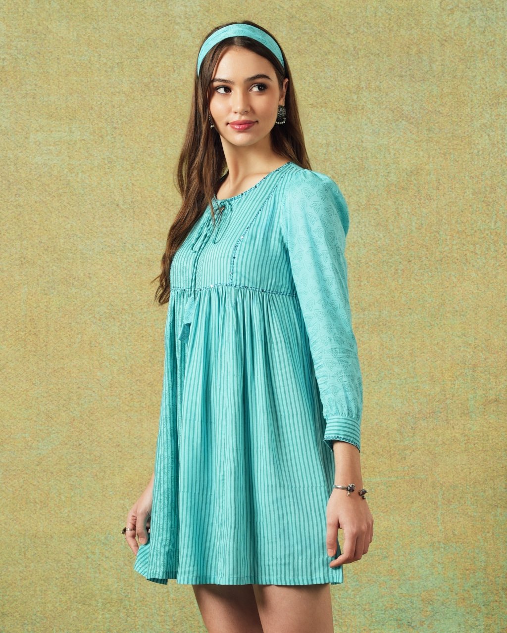 Side view of Model wearing blue moth and stripe block printed empire line dress – RA Studio