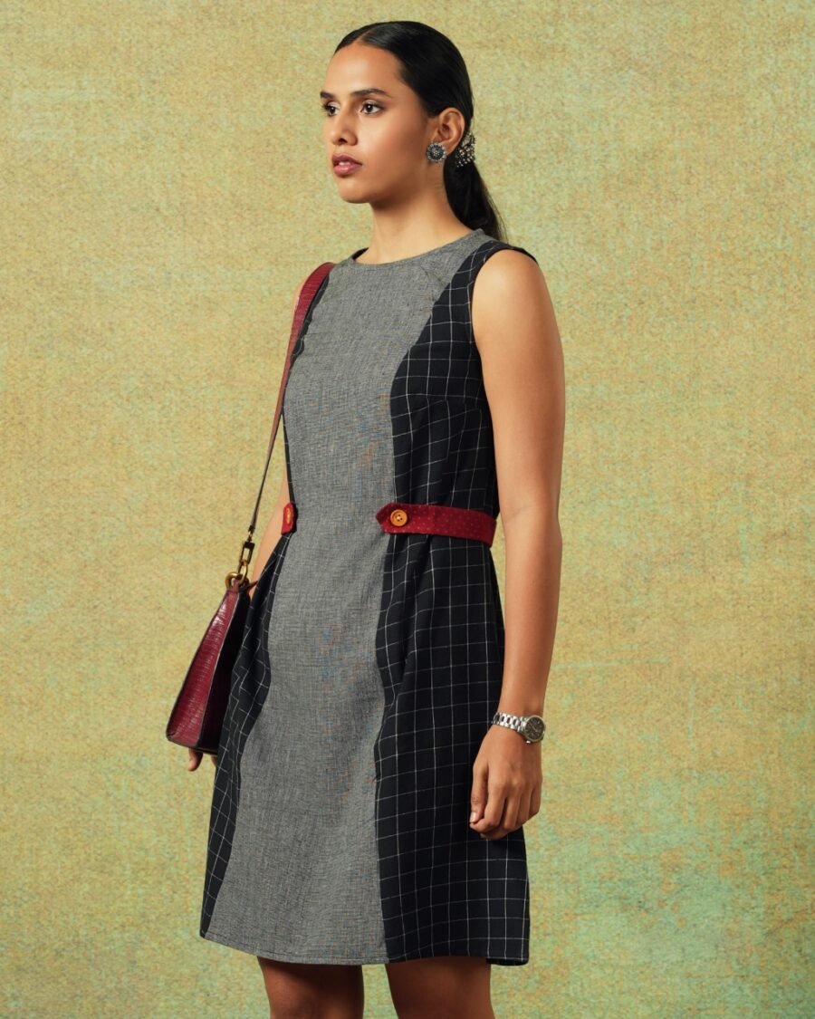Side view of Sleeveless black and grey panel A-line dress with red belt detailing – RA Studio
