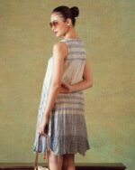 Model wearing blue crinkled empire-line shift dress with layered block-print stripes and pockets – RA Studio