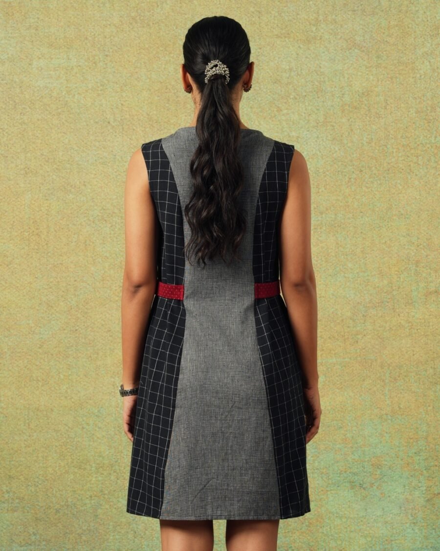 Back view of Sleeveless black and grey panel A-line dress with red belt detailing – RA Studio