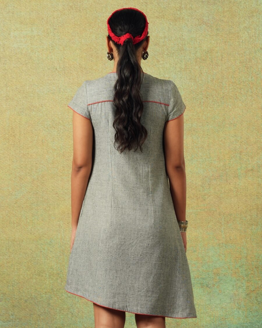 Back view of Short-sleeved grey A-line dress with subtle black and white accents – RA Studio