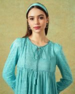 Close up of Model wearing blue moth and stripe block printed empire line dress – RA Studio