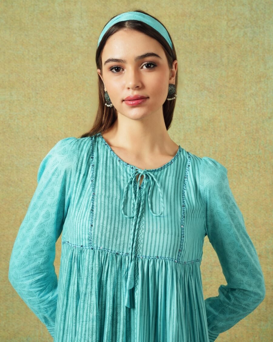 Close up of Model wearing blue moth and stripe block printed empire line dress – RA Studio