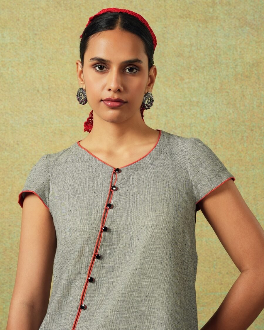 Front Close up Short-sleeved grey A-line dress with subtle black and white accents – RA Studio