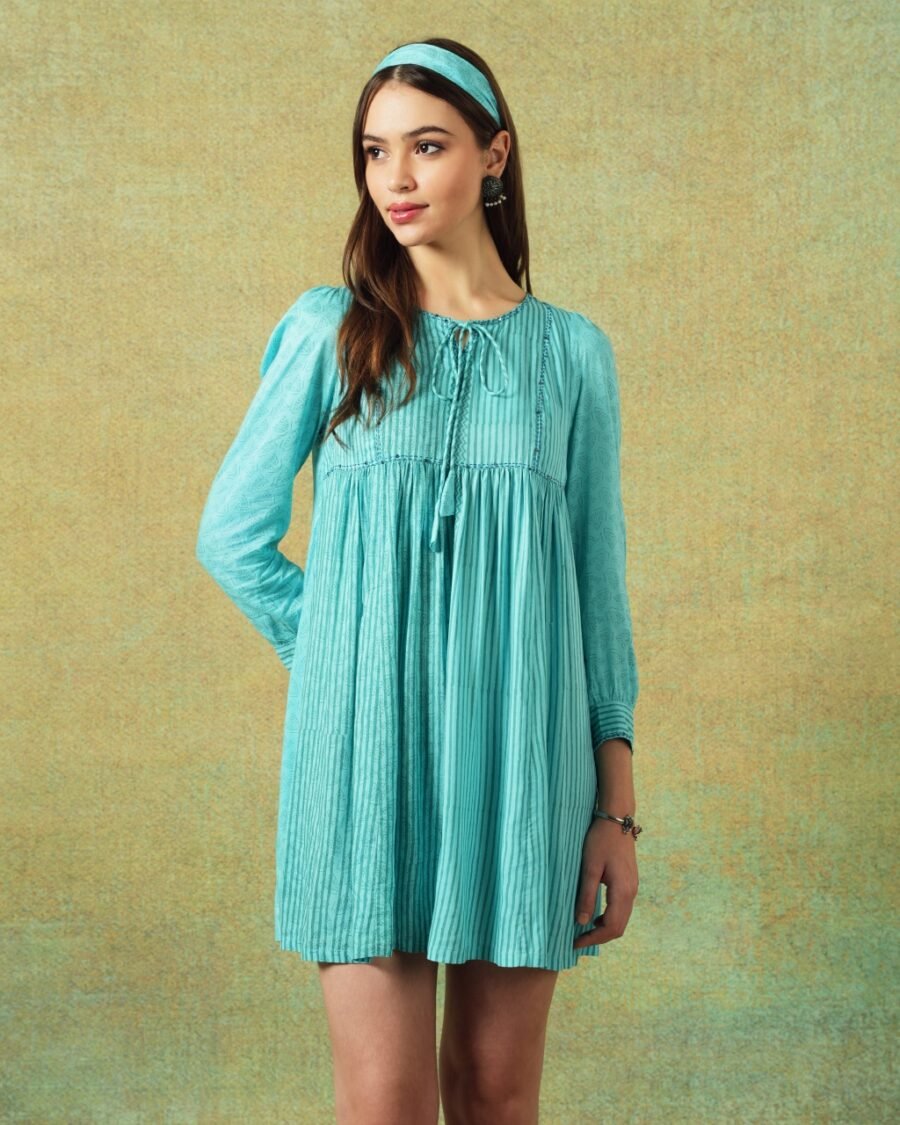 Model wearing blue moth and stripe block printed empire line dress – RA Studio